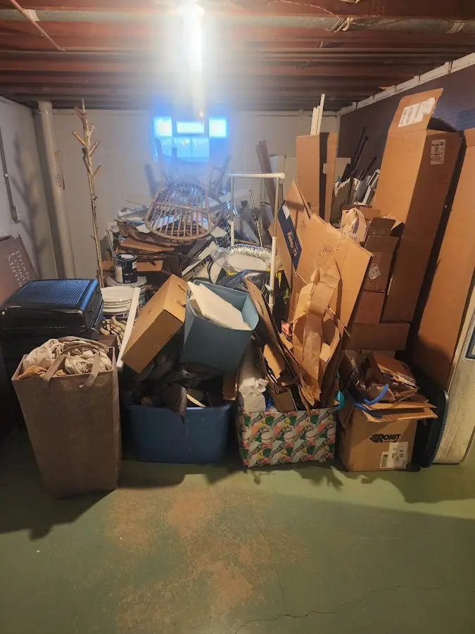 Roll-off dumpster container at job site for Cleanout Dumpster Rental in Menominee